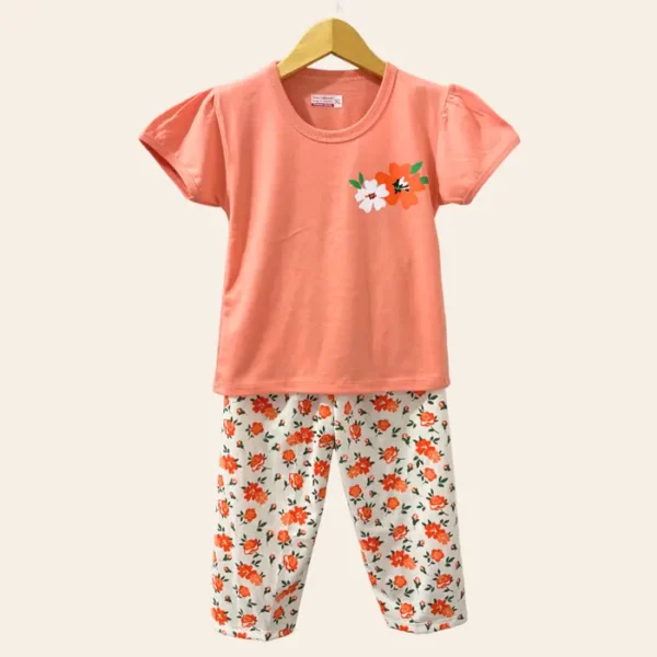 Setelan anak perempuan kaos oranye bunga dan celana panjang motif bunga